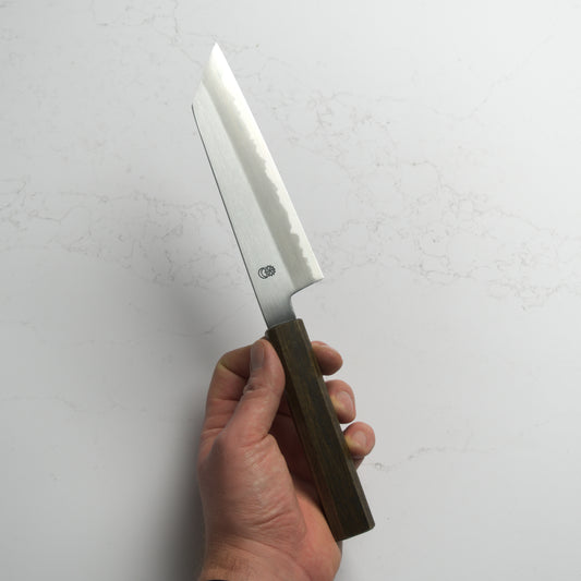 Sakai Kikumori Kikuzuki Kasumi Bunka 180mm – Hand-forged carbon steel Japanese kitchen knife with kasumi finish and refined geometry. Made in Sakai, Japan. Available at Blade & Board.