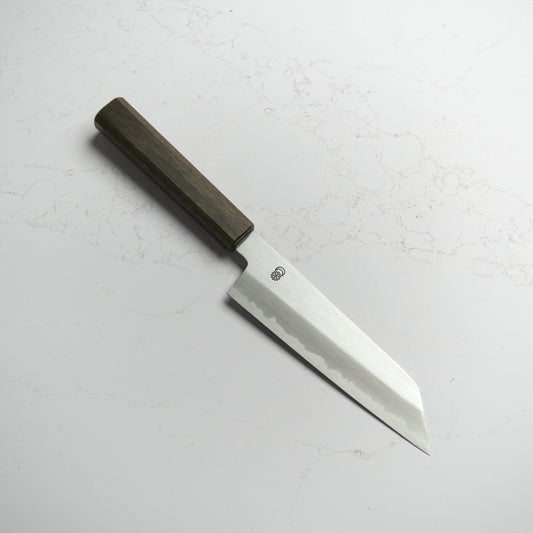 Sakai Kikumori Kikuzuki Kasumi Bunka 180mm – Hand-forged carbon steel Japanese kitchen knife with kasumi finish and refined geometry. Made in Sakai, Japan. Available at Blade & Board.