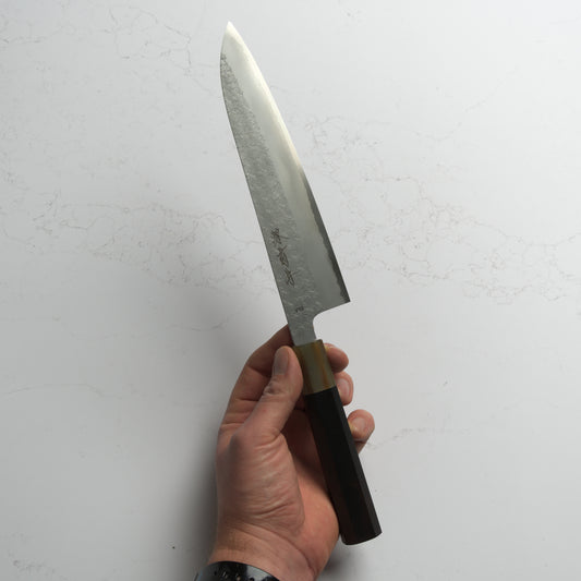 Sakai Kikumori VG10 Gyuto 210mm – Japanese chef’s knife made from VG10 stainless steel with a classic wa handle. Precision-crafted in Sakai, Japan. Available at Blade & Board.