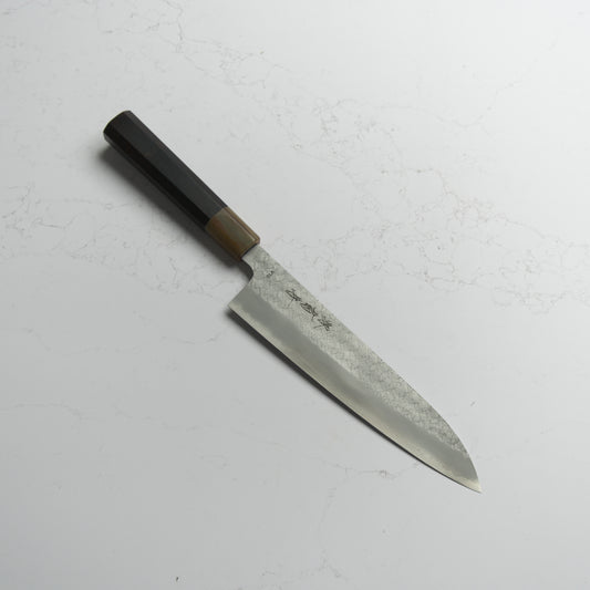 Sakai Kikumori VG10 Gyuto 210mm – Japanese chef’s knife made from VG10 stainless steel with a classic wa handle. Precision-crafted in Sakai, Japan. Available at Blade & Board.