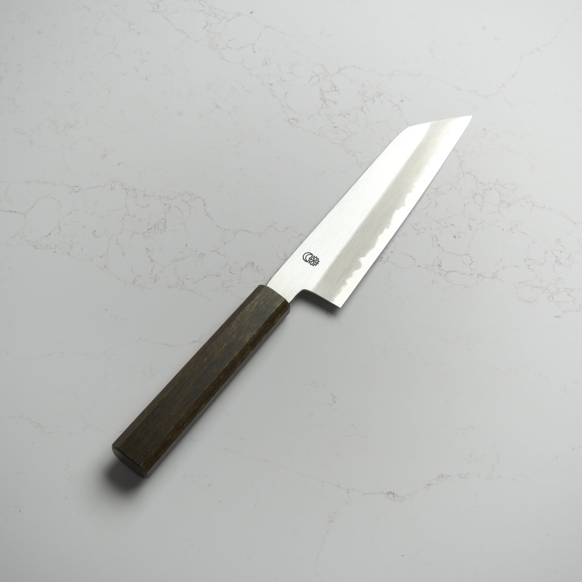 Sakai Kikumori Kikuzuki Kasumi Bunka 180mm – Hand-forged carbon steel Japanese kitchen knife with kasumi finish and refined geometry. Made in Sakai, Japan. Available at Blade & Board.