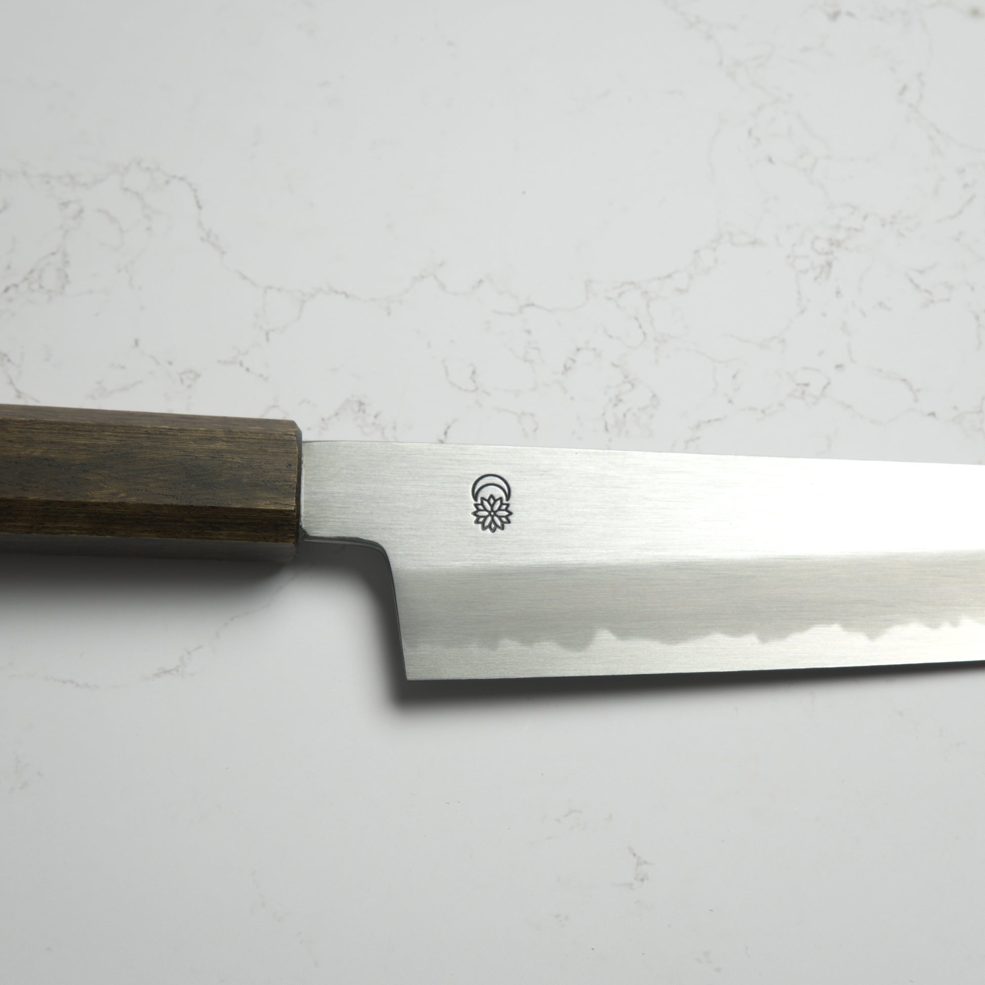 Sakai Kikumori Kikuzuki Kasumi Bunka 180mm – Hand-forged carbon steel Japanese kitchen knife with kasumi finish and refined geometry. Made in Sakai, Japan. Available at Blade & Board.