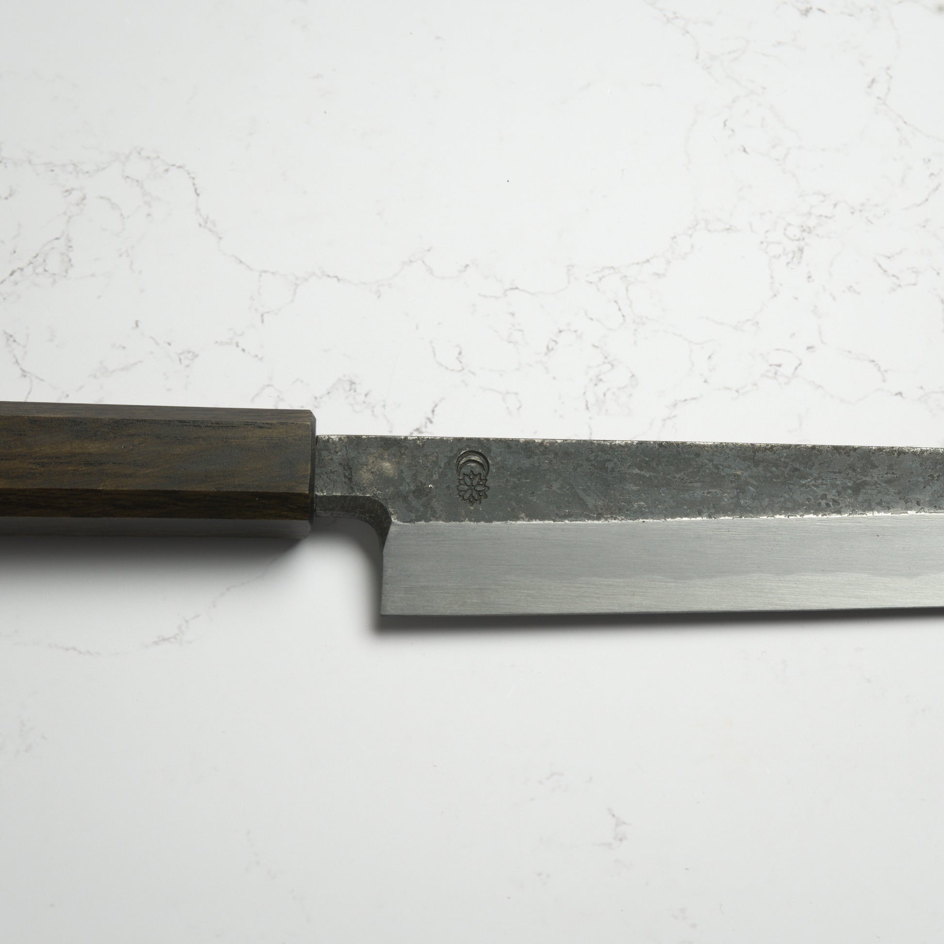 Sakai Kikumori Kikuzuki Kuro Yanagiba 270mm – Traditional carbon steel Japanese sushi knife with a kurouchi finish and octagonal handle. Handcrafted in Sakai, Japan. Available at Blade & Board.
