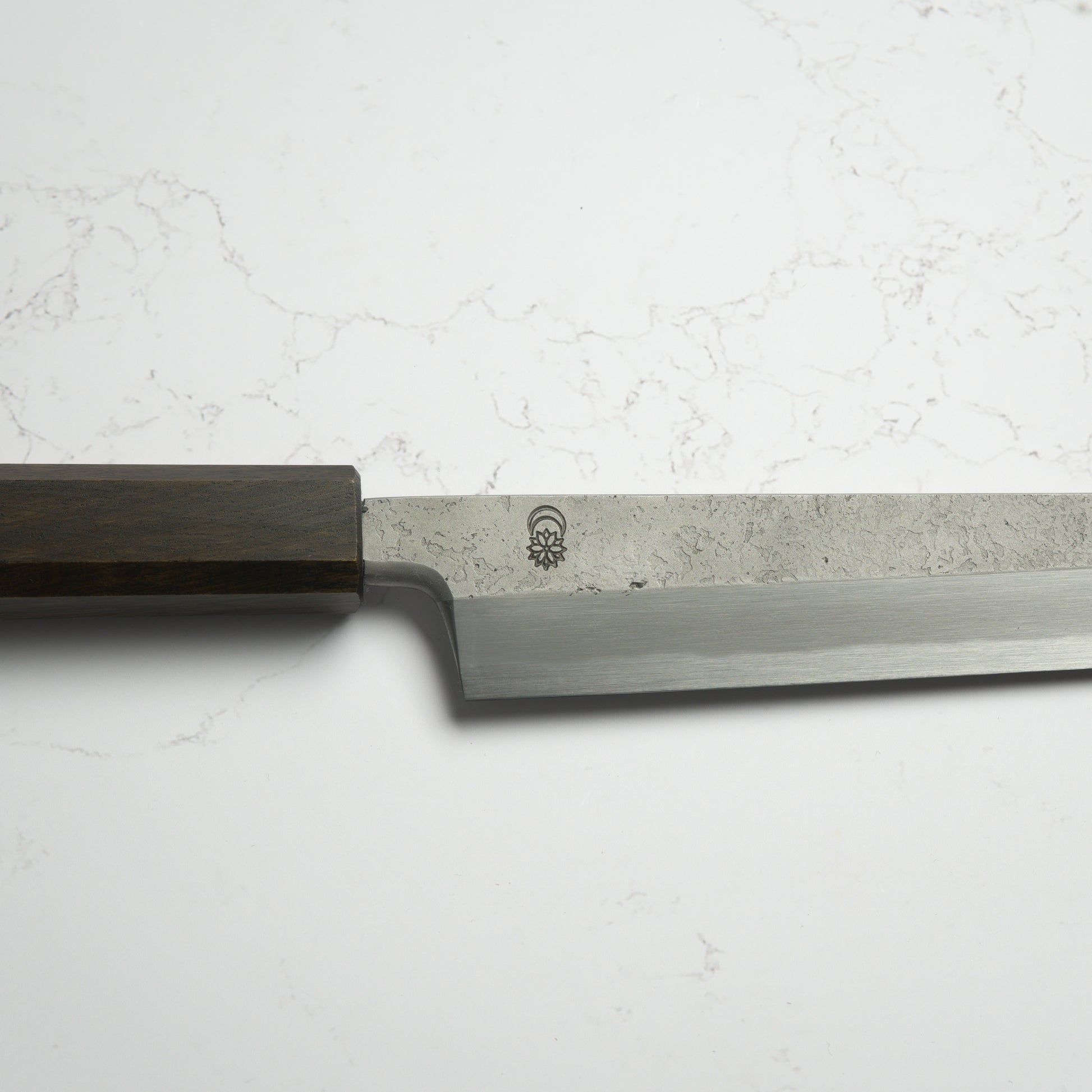 Sakai Kikumori Kikuzuki Rin Yanagiba 270mm – Hand-forged carbon steel sushi knife with ebony handle, crafted in Sakai, Japan. Available at Blade & Board.