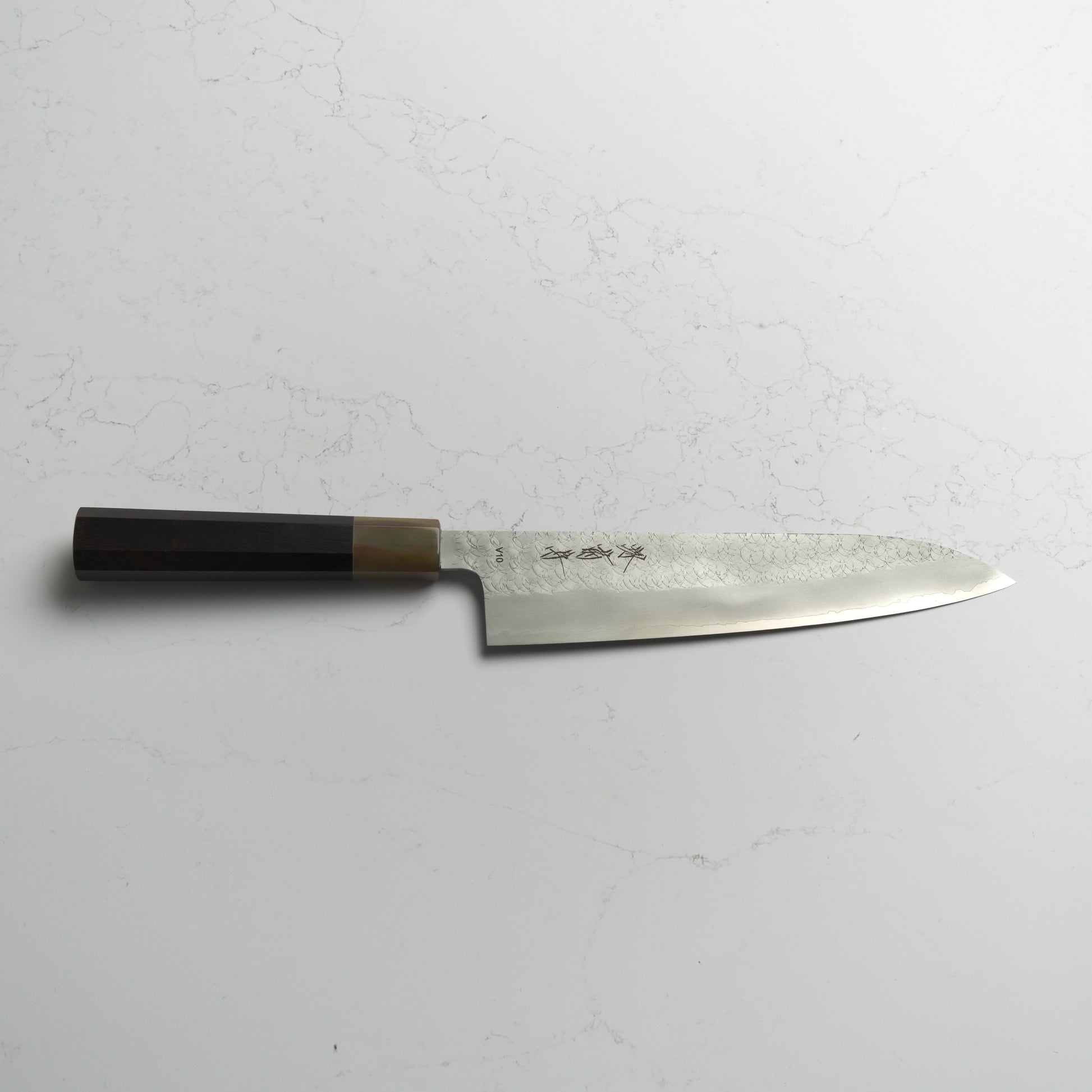 Sakai Kikumori VG10 Gyuto 210mm – Japanese chef’s knife made from VG10 stainless steel with a classic wa handle. Precision-crafted in Sakai, Japan. Available at Blade & Board.